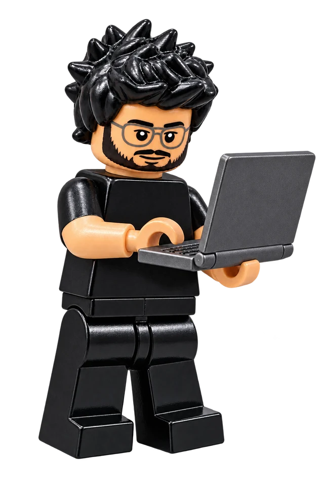 Lego minifigure of Uriel holding a laptop